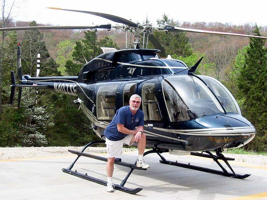 Charlie Duchek with Bell 407 jet helicopter